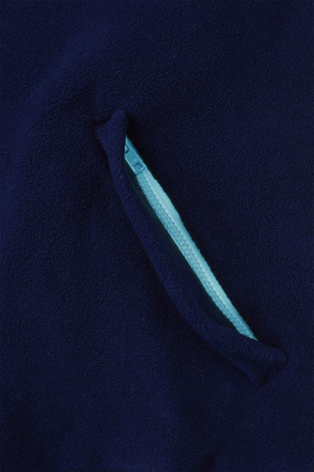 pocket detail close up view of mens quarter zip polartec fleece navy with sky blue trimnattily dressed navy blue fleece quarter zip with sky blue trim