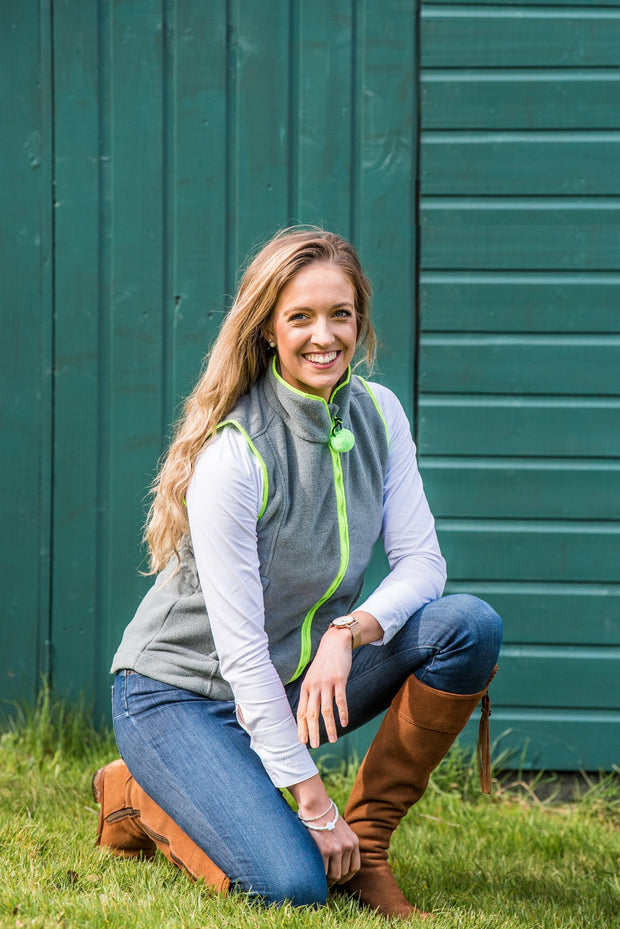 model wearing ladies grey fleece gilet with lime green trim nattily dressed