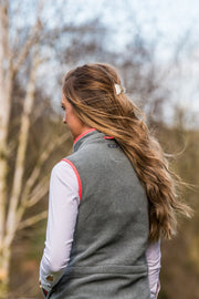 model wearing ladies grey fleece gilet with coral trim nattily dressed