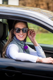 model in car wearing ladies grey fleece gilet with purple trim