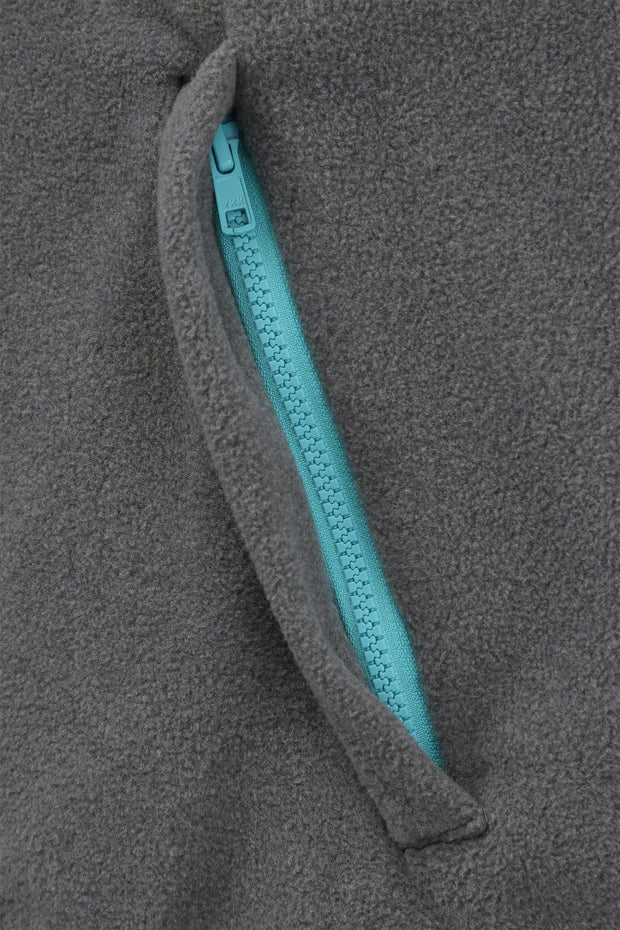pocket detail of nattily dressed grey fleece quarter zip with sky blue trim